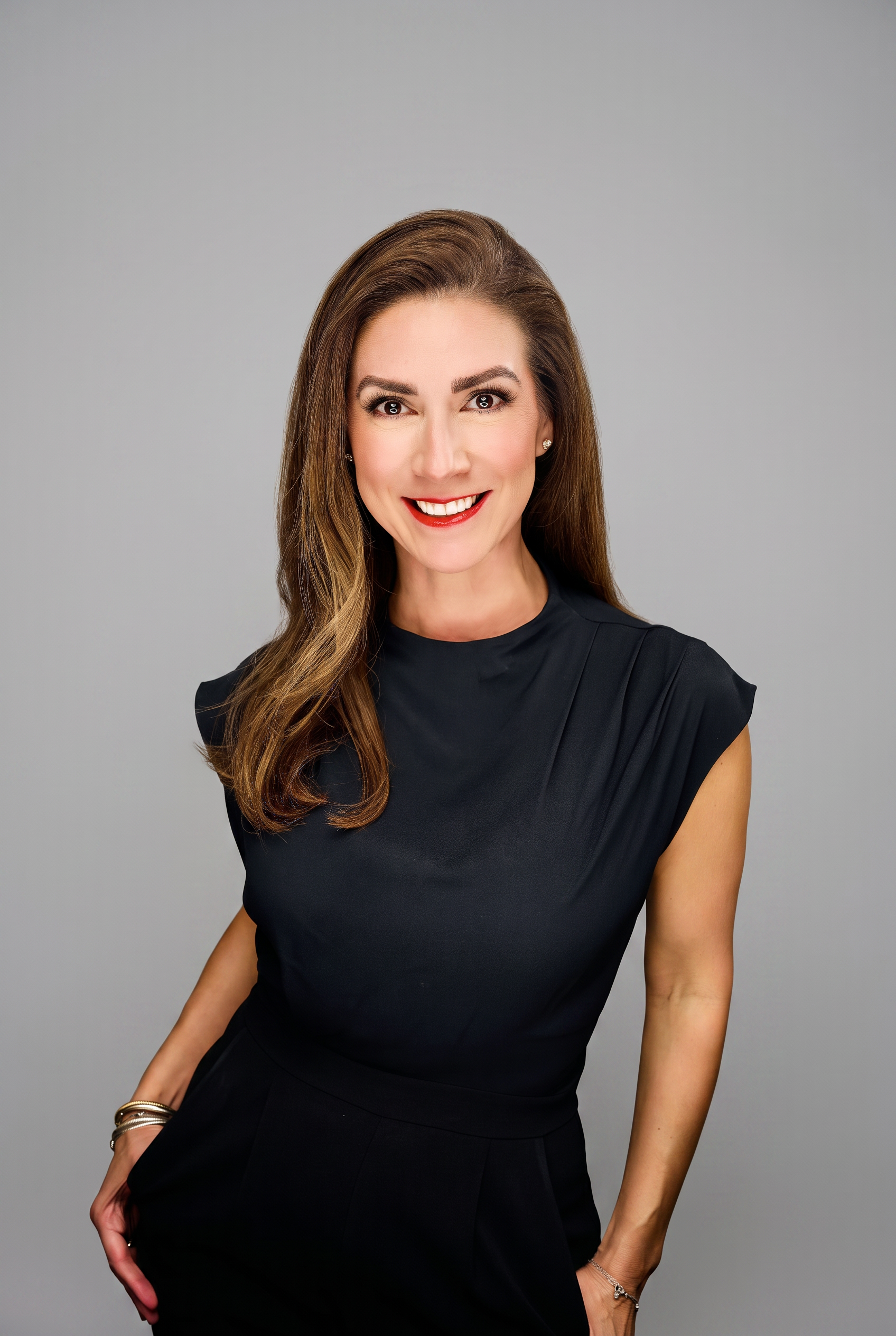 Virginia, Houston Realtor, smiling in a black dress